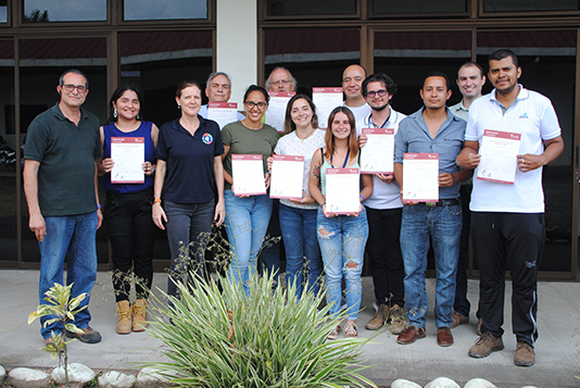 Students holding certificates