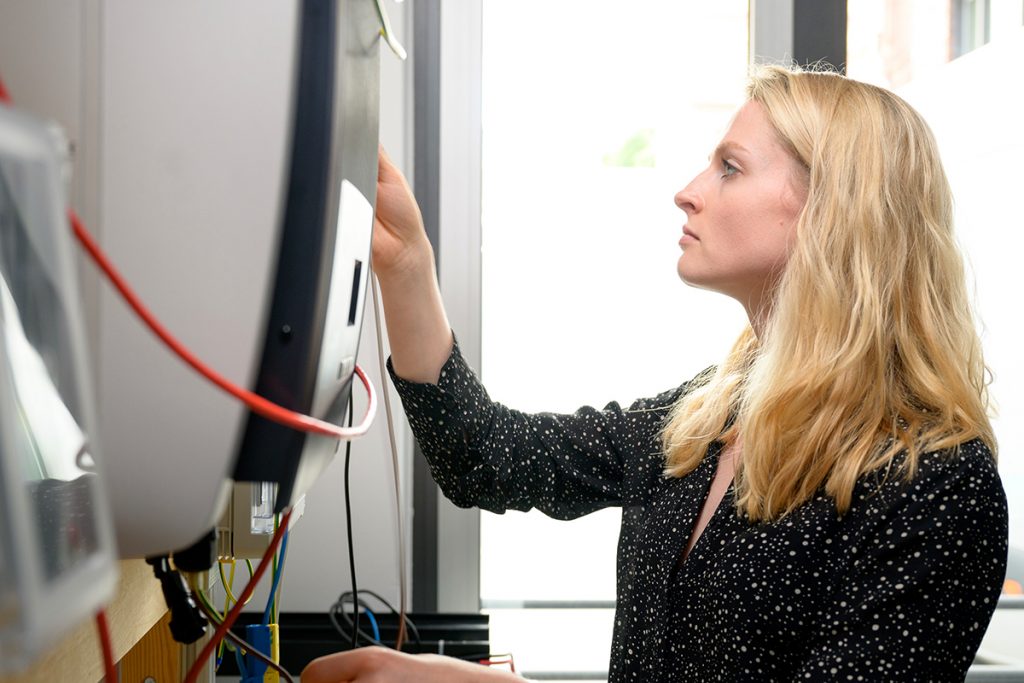 Woman seeing a solar thermal device