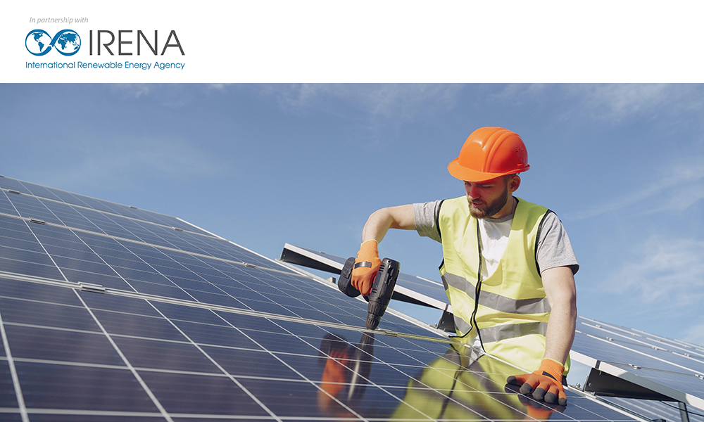 Man fixing solar panels with open background